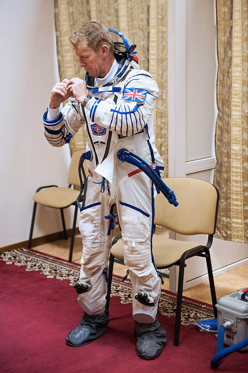 Tim Peake dressing up in the Sokol suit for Soyuz exams at Star City. Credits: UKSA-M. Alexander